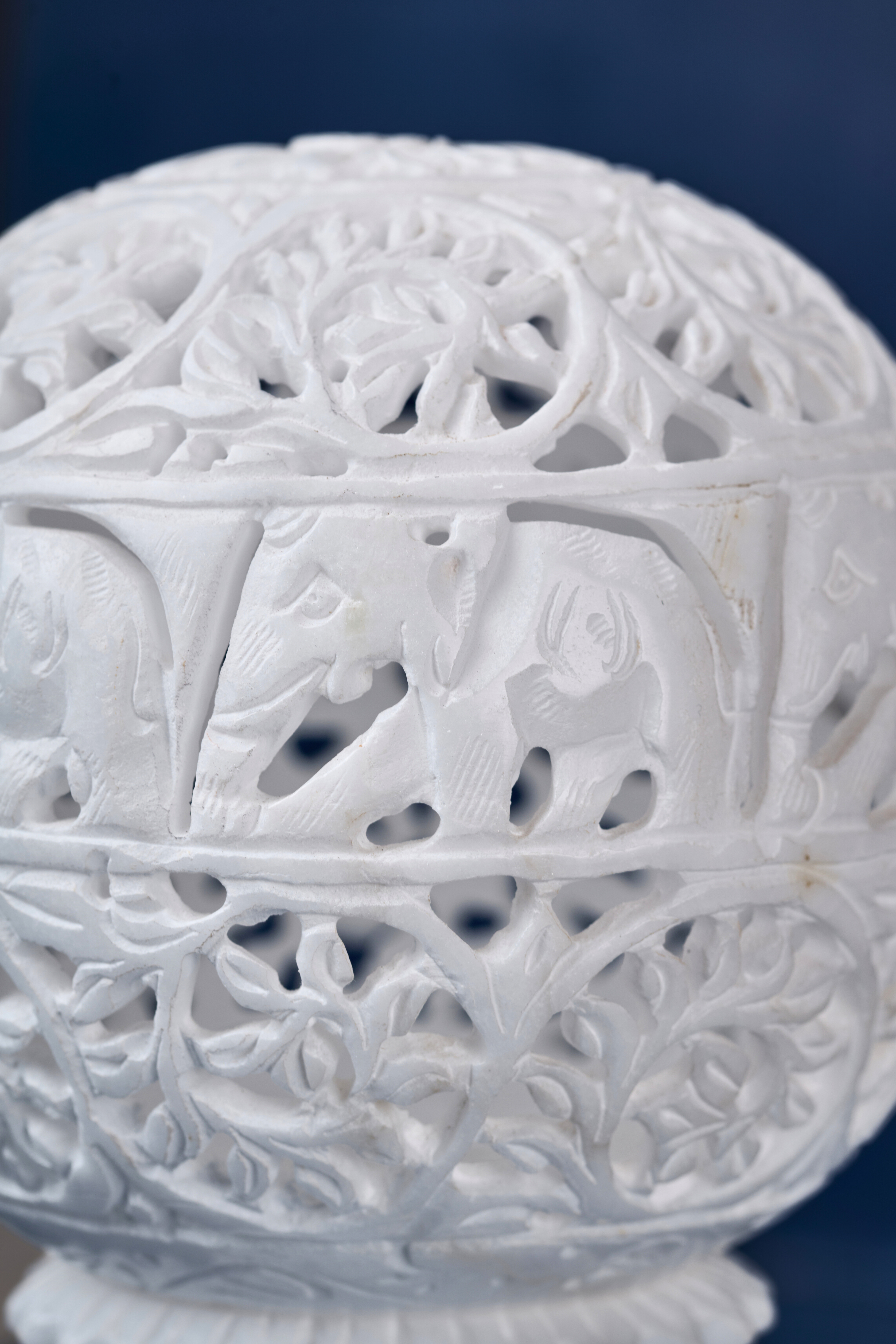 Side view of carved soapstone lampshade with ornate motifs – spiritual home decor lighting accent