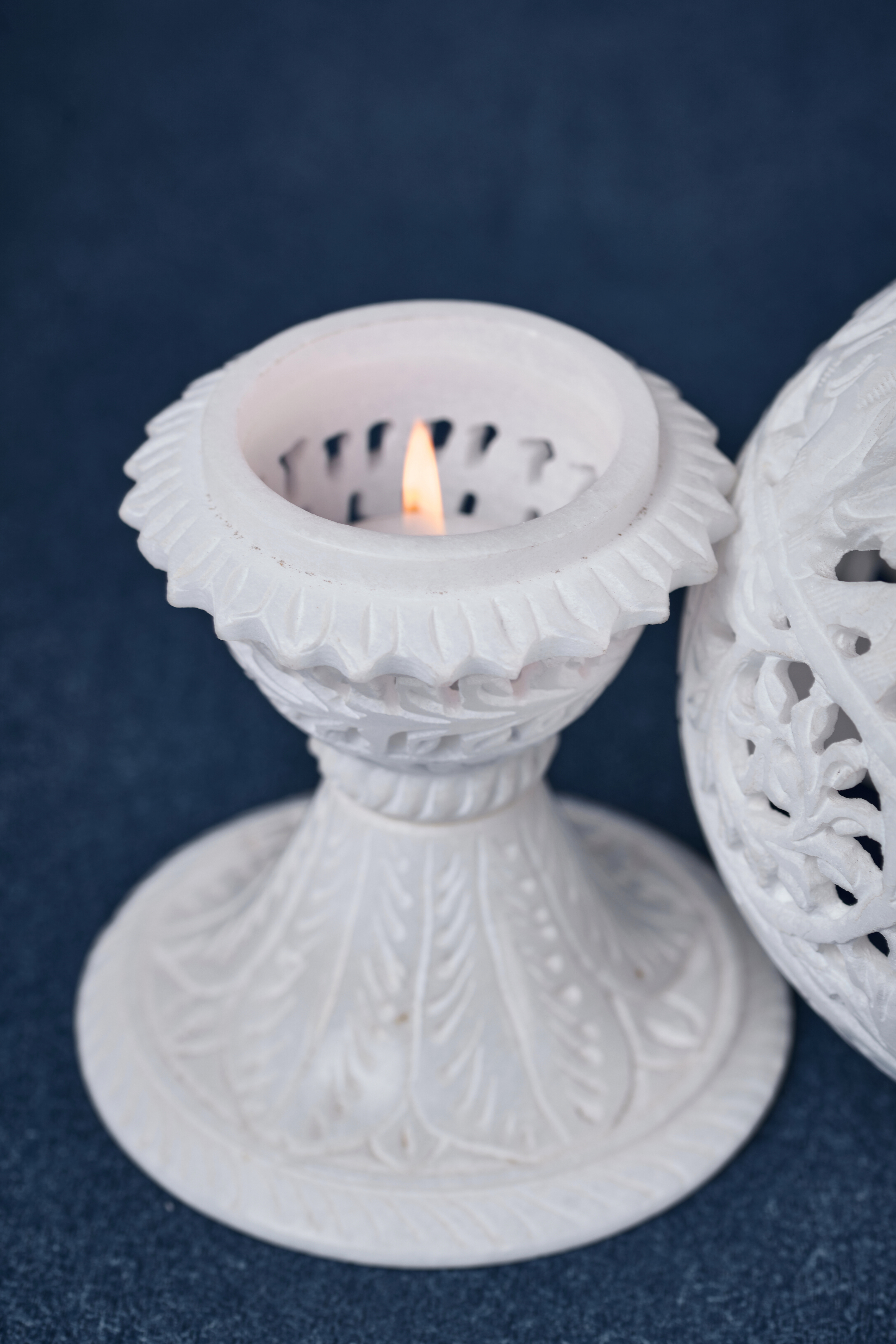 Top view of carved soapstone lamp showcasing floral cutwork – artisan handcrafted decor element