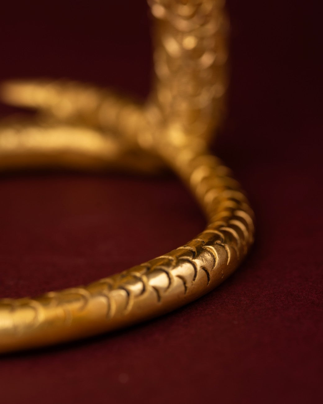 Close view brass cobra coil detailed serpent texture Indian spiritual decor handcrafted accent