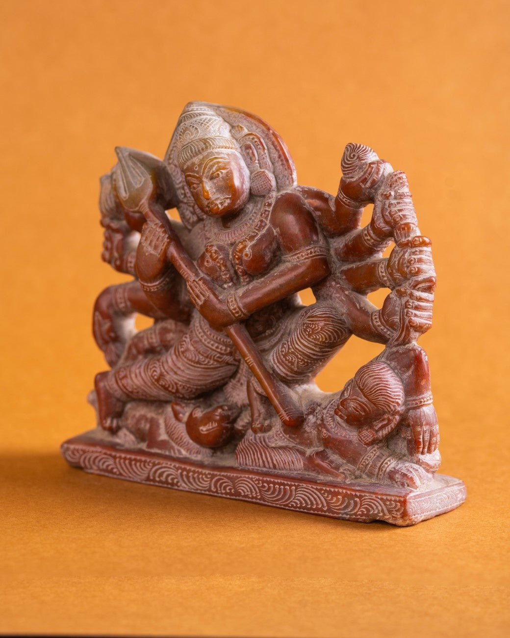 Premium red stone statue of Goddess Kali – traditional Indian sculpture symbolising strength