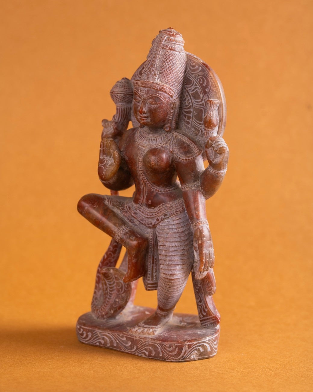 Shiva Parvati Ardhanarishwar statue red stone side profile of dual form