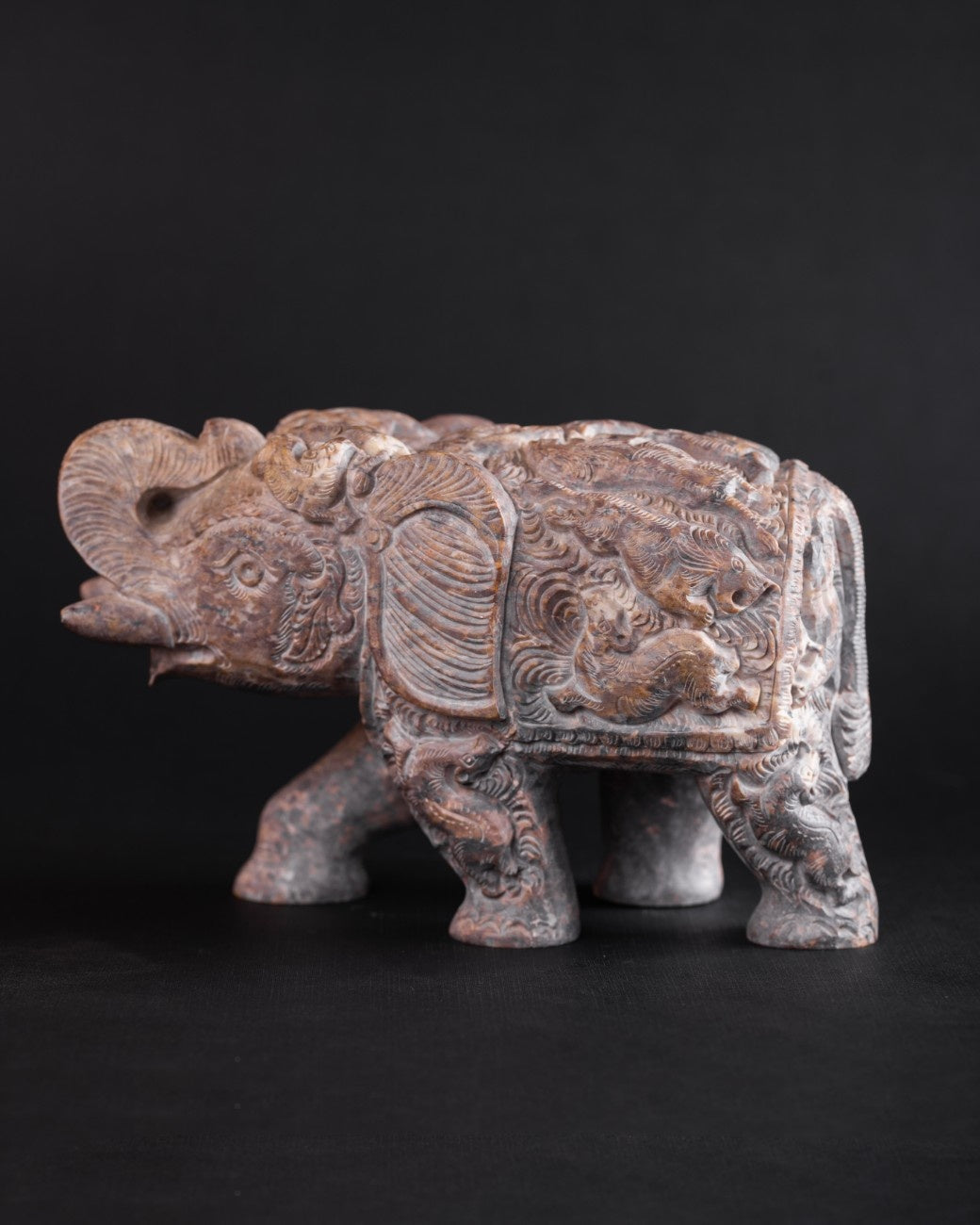 Brass Engraved Elephant Statue: “Hand‑engraved marble elephant statue with trunk raised