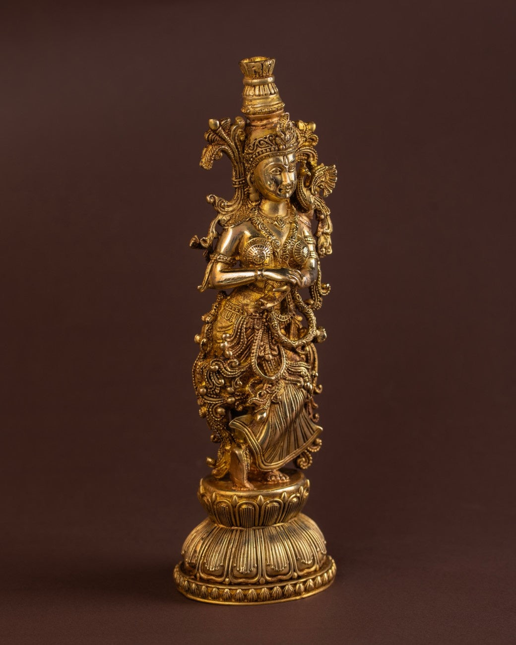 Full standing brass Radha sculpture with floral motifs and fine metal artistry, Indian spiritual décor piece.
