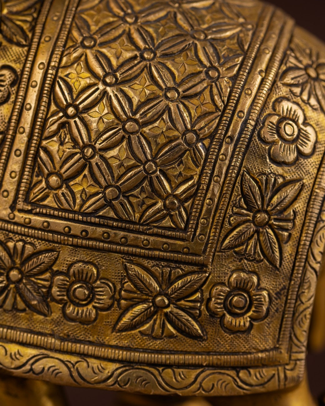 Engraved brass elephant statue with traditional patterns