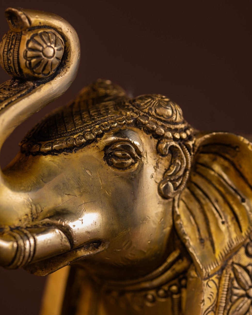 Engraved brass elephant statue with traditional patterns
