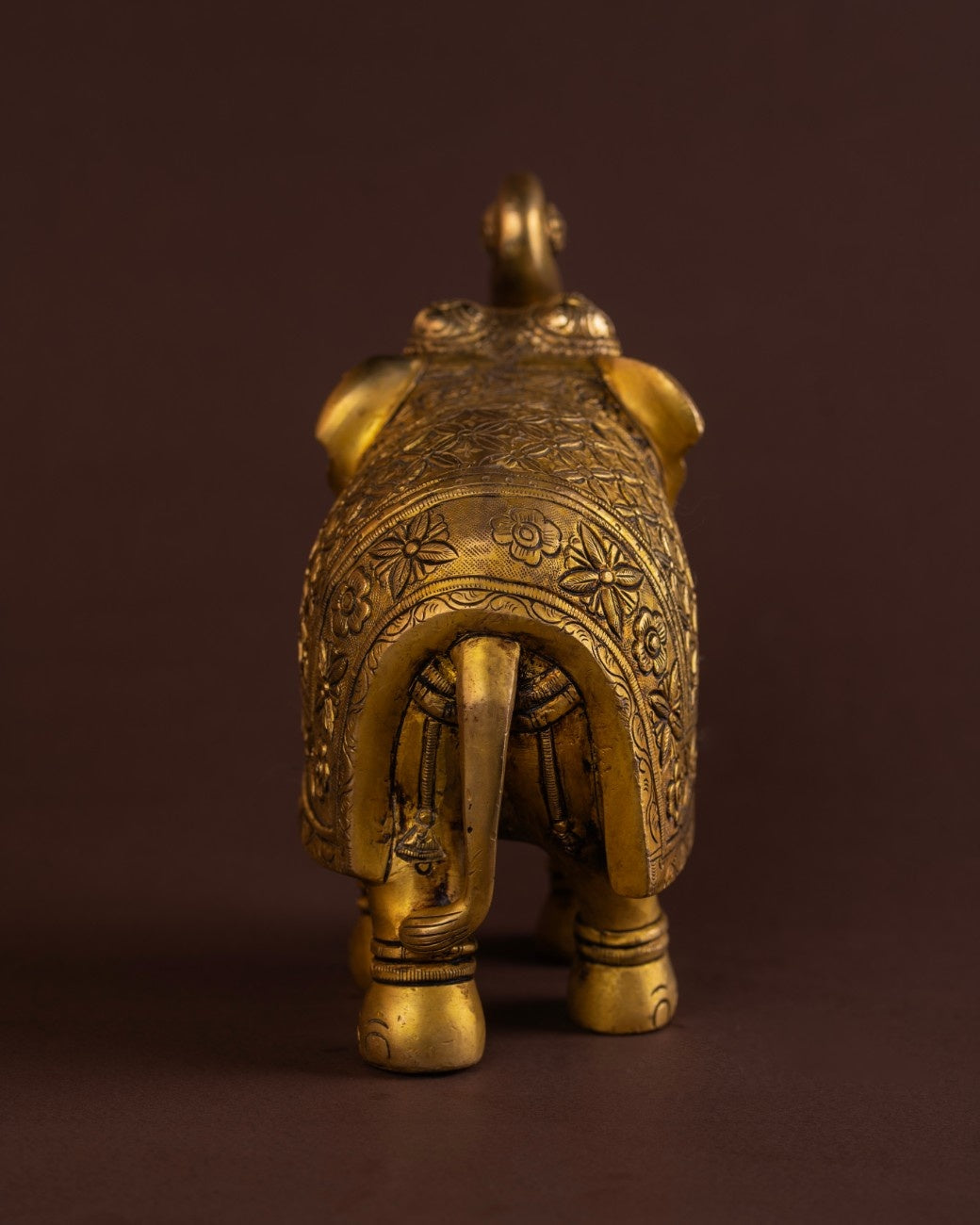 Engraved brass elephant statue with traditional patterns