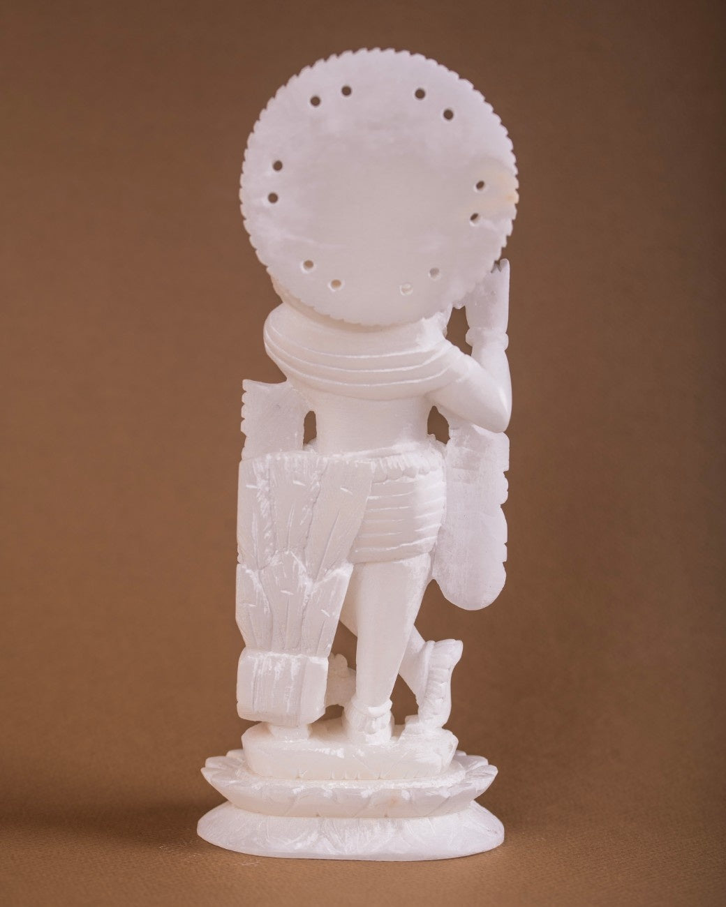 Hand-carved white marble Krishna statue with intricate drapery detailing, for home décor, temple altars, and sacred Indian art collections.