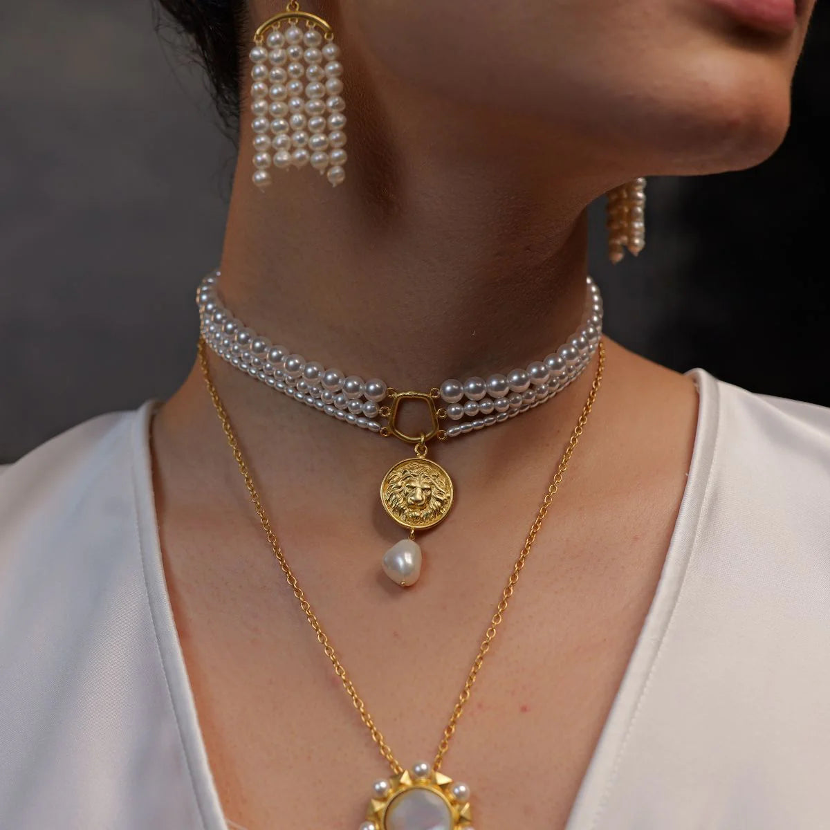gold plated pearl choker necklace with round coin pendant and teardrop pearl detail