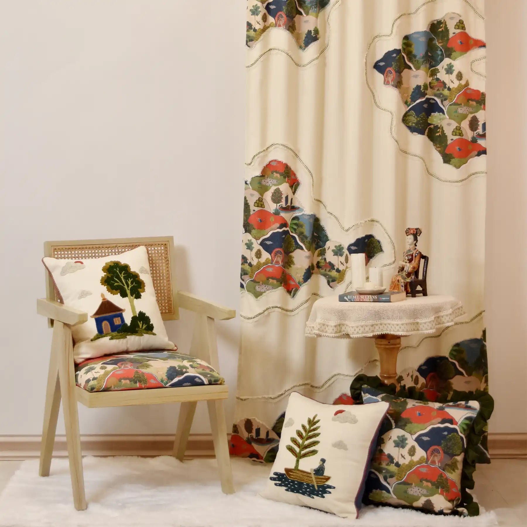 Celestial Village Pagoda cushion cover styled in a room setting with floral cushions.