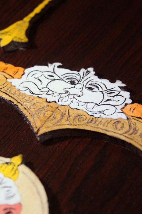 Close-up detail of a Mysore rosewood inlay artwork showing layered three-dimensional carving and fine inlay work depicting Lord Venkateshwara, highlighting traditional woods, composite materials, and precise hand craftsmanship from Mysuru.