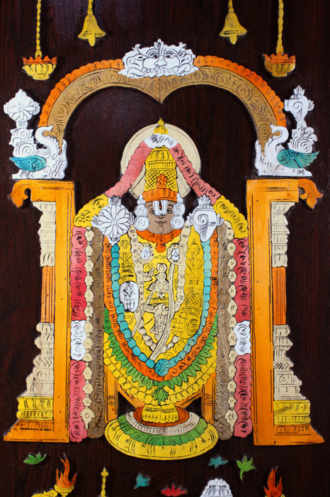 Close-up detail of a Mysore rosewood inlay artwork showing layered three-dimensional carving and fine inlay work depicting Lord Venkateshwara, highlighting traditional woods, composite materials, and precise hand craftsmanship from Mysuru.