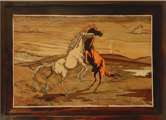 Entire view of a framed Mysore rosewood inlay artwork depicting horses in playful motion, handcrafted in Karnataka using traditional inlay techniques, displayed against a warm background.