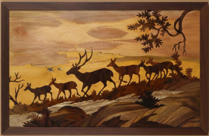 Handcrafted Mysore rosewood inlay wall panel depicting silhouetted deer moving through a forest landscape, framed in dark wood, created using traditional South Indian inlay techniques from Karnataka.