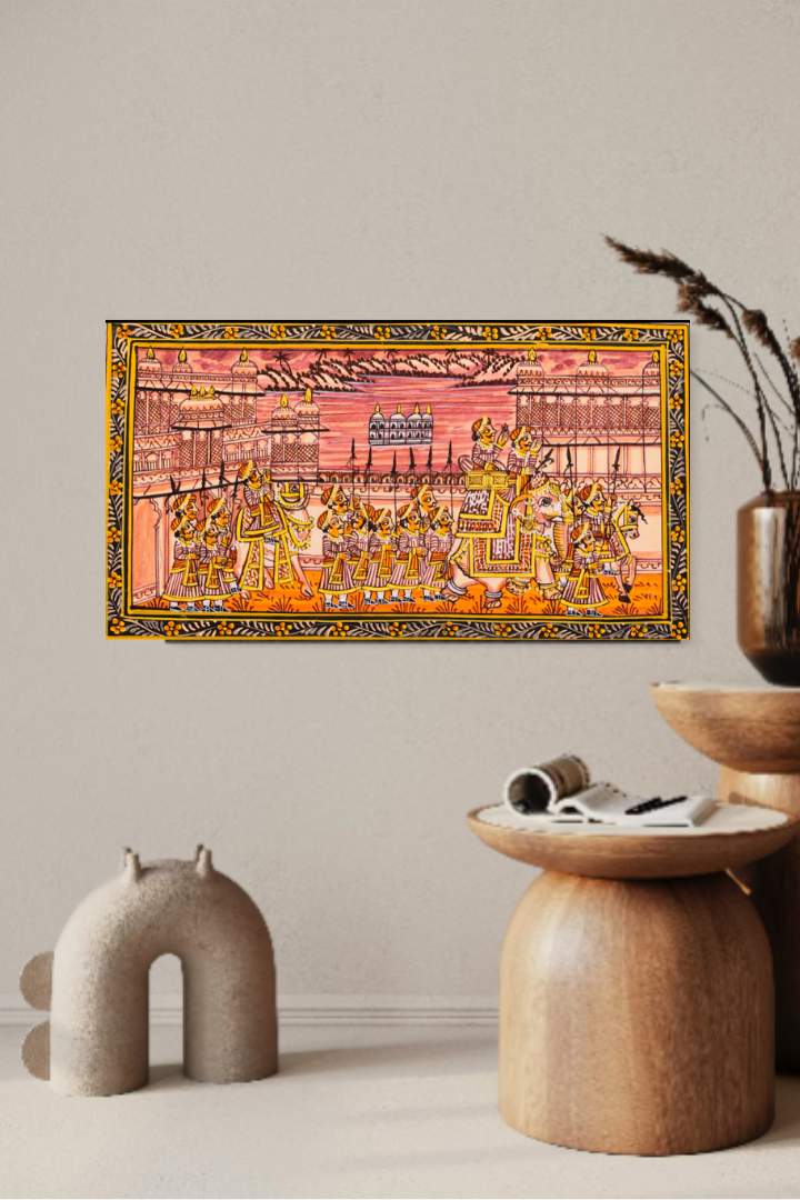 Decorative setup with a colorful painting, vase, and small table on a light background