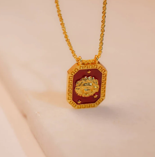 Gold Leo zodiac tablet necklace with red enamel front and lion motif