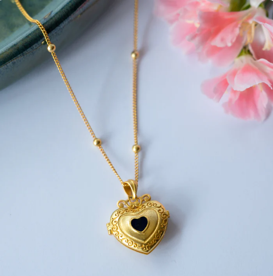 gold-finish heart locket necklace with photo space, elegant keepsake jewelry for women, perfect for gifting loved ones