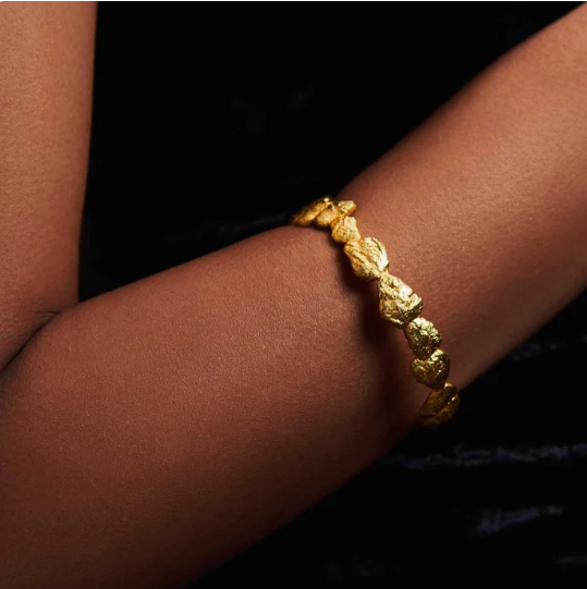 gold-plated nugget bangle worn on wrist, chic statement bracelet for women, gifting jewelry