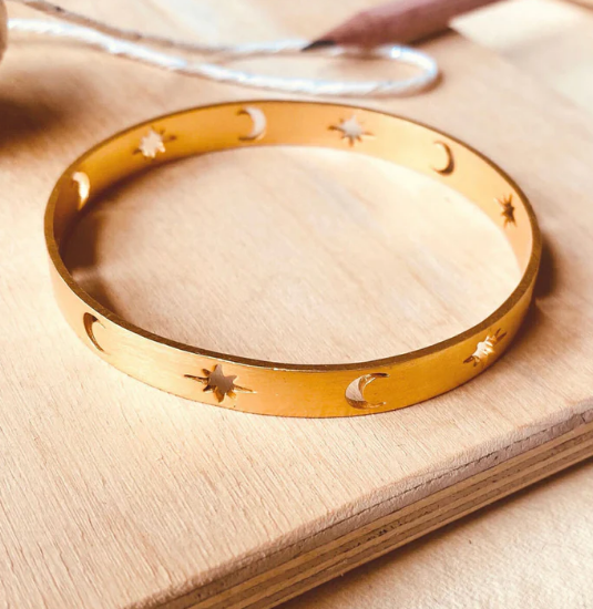 gold-plated celestial bangle on soft fabric, boho moon-and-star bracelet for women, gifting jewelry