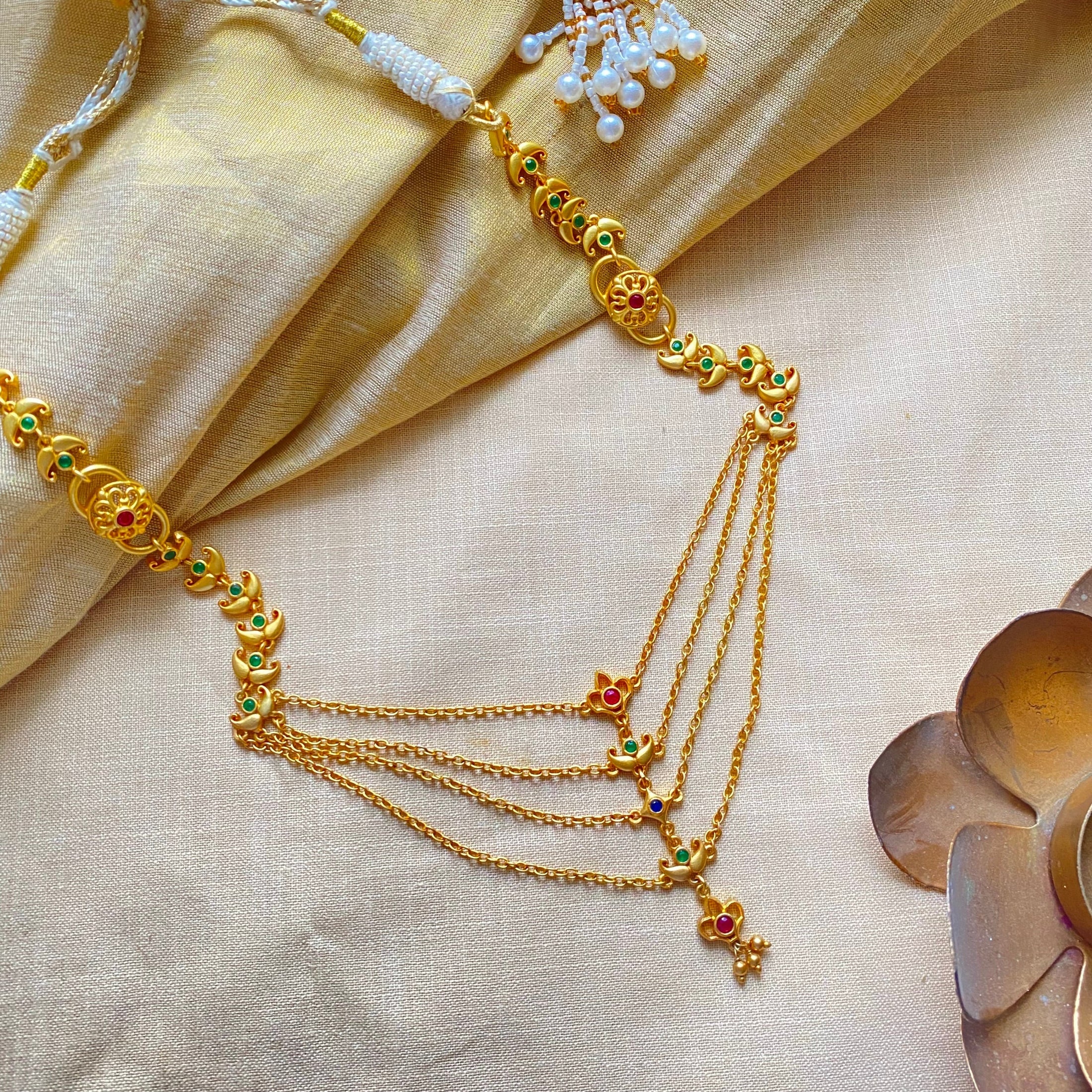flatlay of gold-plated layered rajwada necklace, traditional Indian statement jewelry for women, gifting and occasion wear accessory