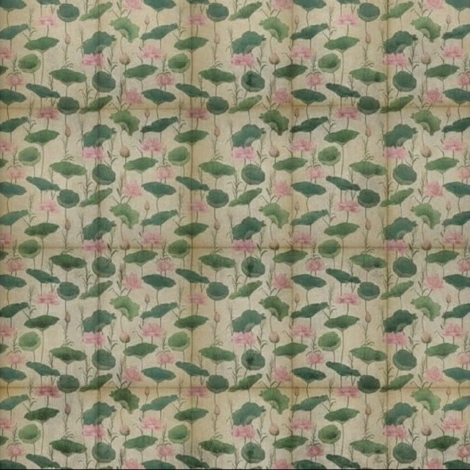 Floral patterned fabric with green leaves and pink flowers on a beige background