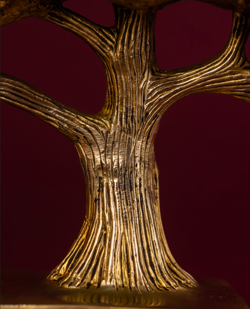 Close-up of brass Banyan Tree trunk with textured bark and branching detail
