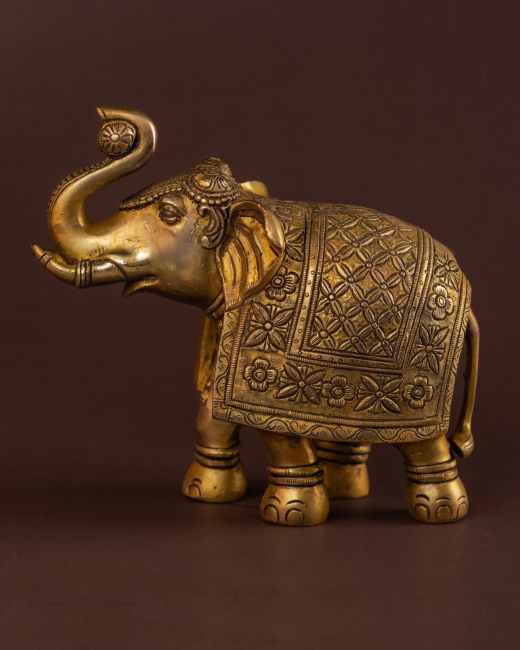 Engraved brass elephant statue with traditional patterns
