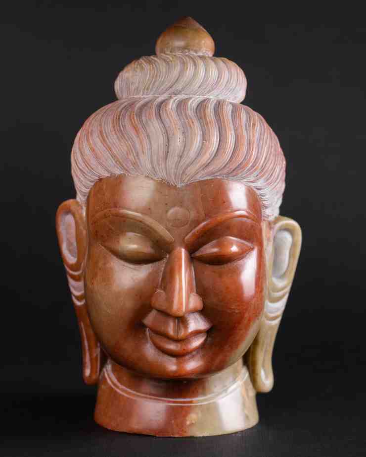 Red stone statue of buddha