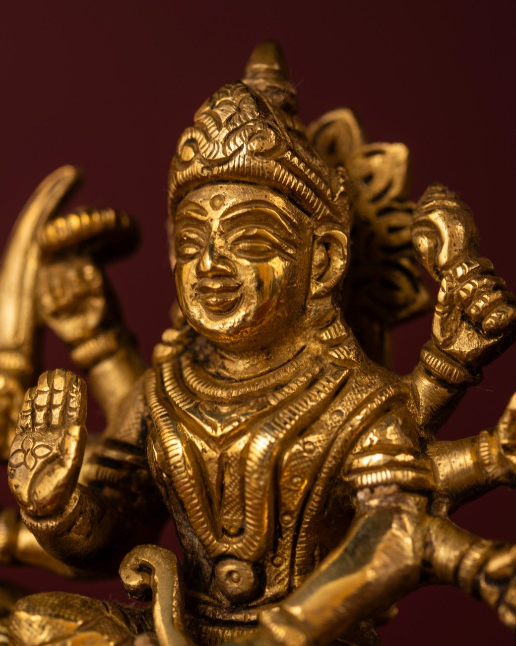 Front view of Indian brass statue of Durga seated on lion – premium brass sculpture