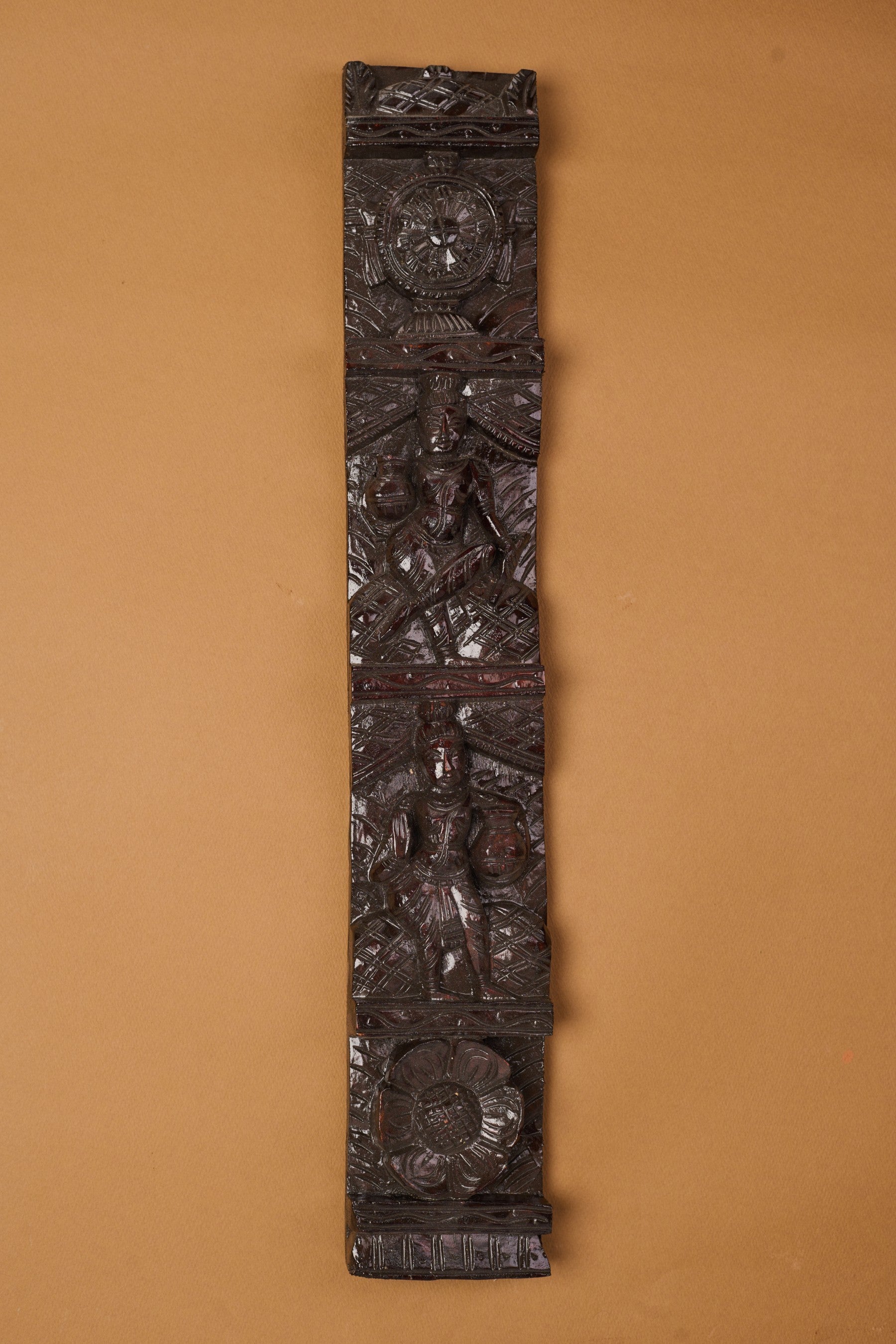 Exquisitely handcrafted wooden wall hanging featuring detailed carving and natural wood texture, designed to add warmth and artisanal elegance to home décor