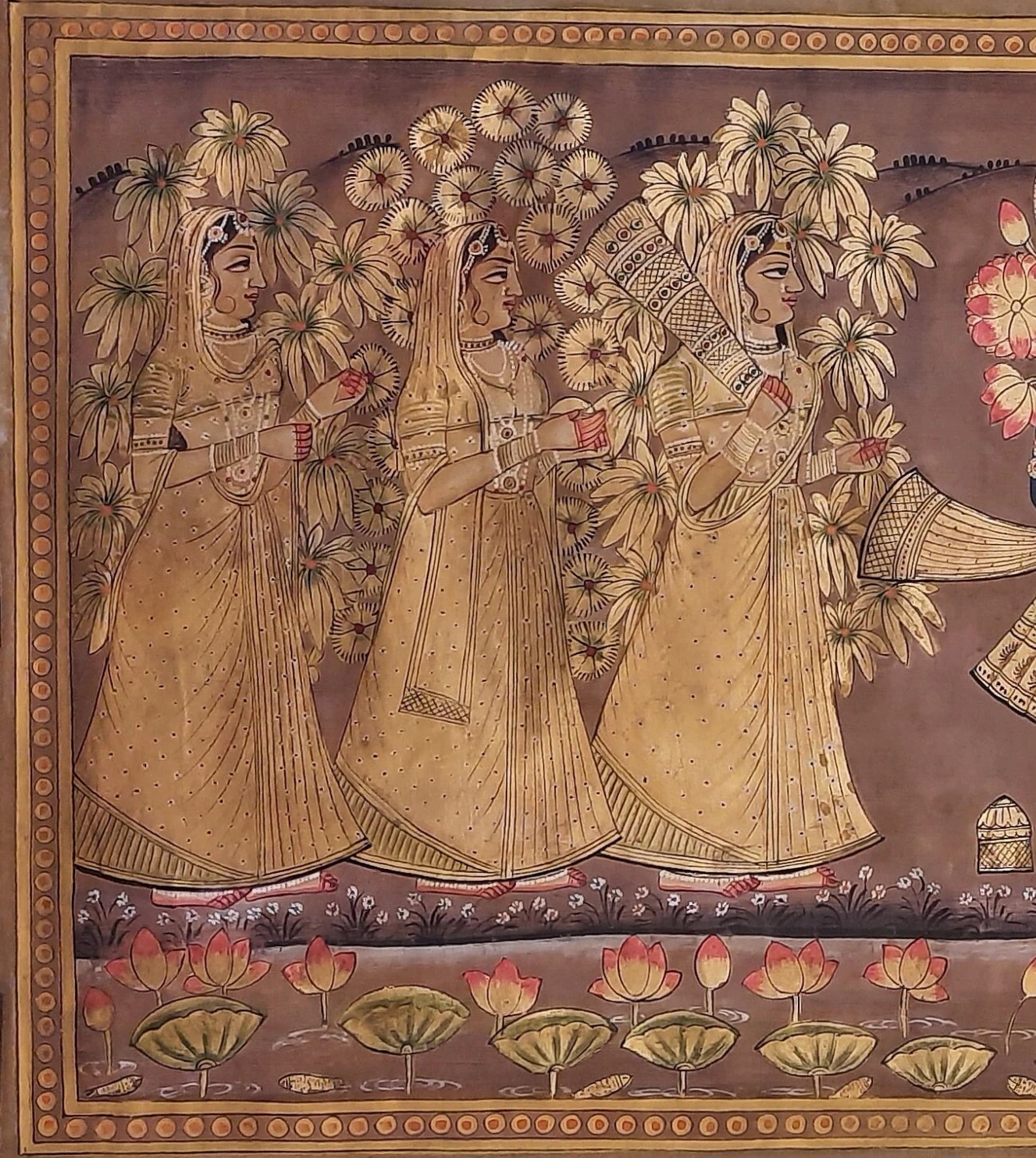 Golden Pichwai painting showing gopis gathered around Lord Shrinathji in Vrindavan setting