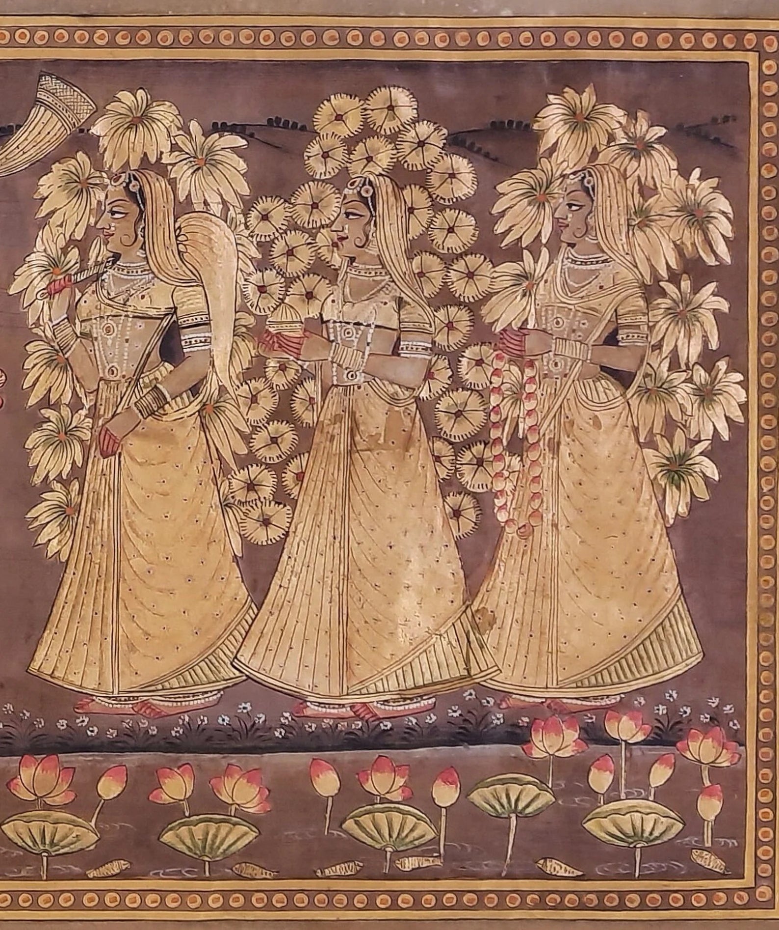 Traditional Golden Pichwai artwork featuring a group of gopis in devotional harmony