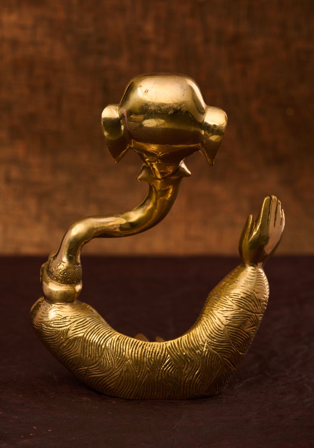 Wall‑mountable Indian brass sculpture of Lord Ganesh cut‑out – premium brass statue for home décor.