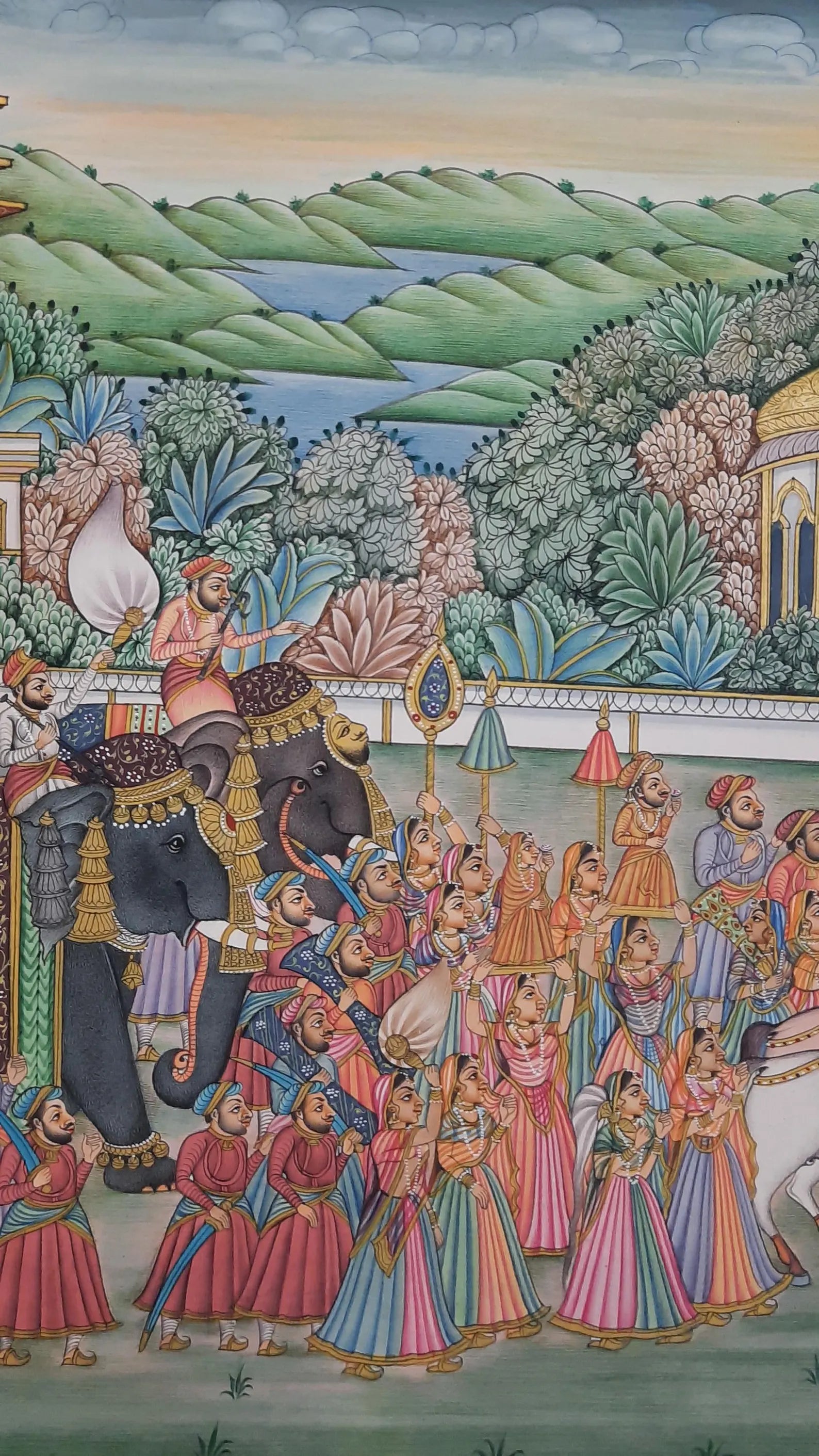 Vertical Indian miniature painting illustrating a ceremonial royal procession with elephants and nobles