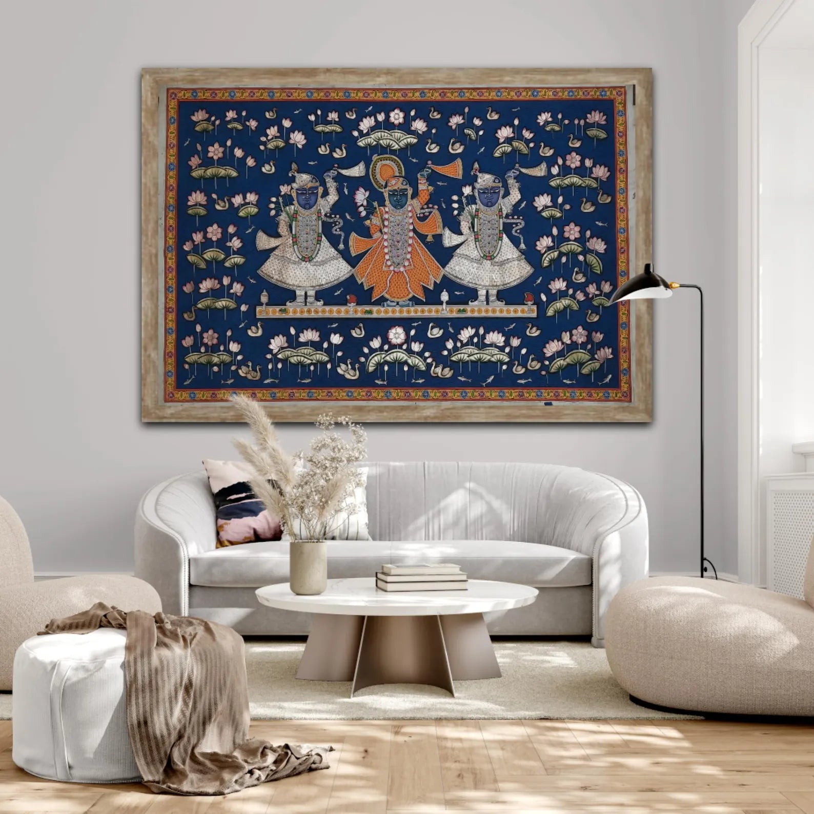 Traditional Pichwai painting of Lord Shrinathji styled in a neutral interior, highlighting intricate detailing and rich blue tones