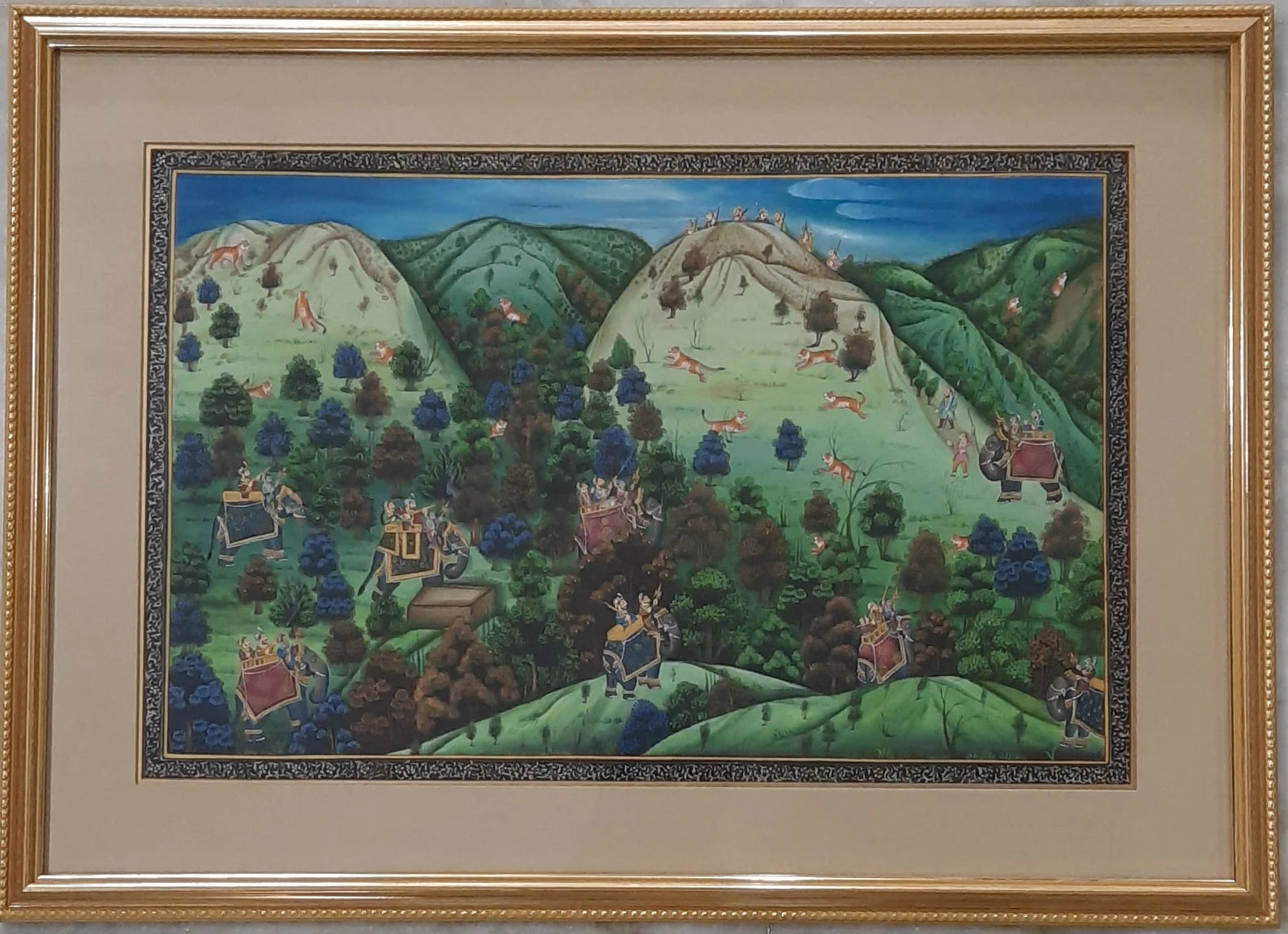 Framed silk painting showing a traditional Maharaja hunting scene in Indian art style