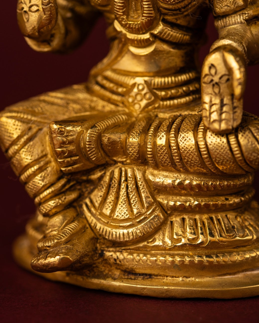 Detailed image of the lotus base of the brass sculpture of Lakshmi – Indian brass statue with intricate design