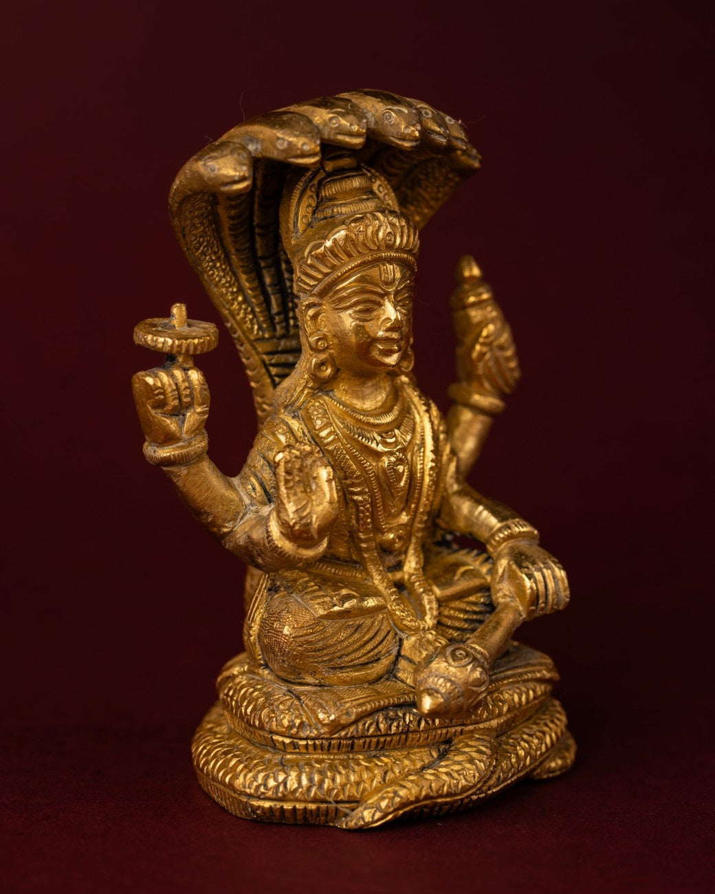 Right angle view of Shiva brass idol highlighting balanced seated form