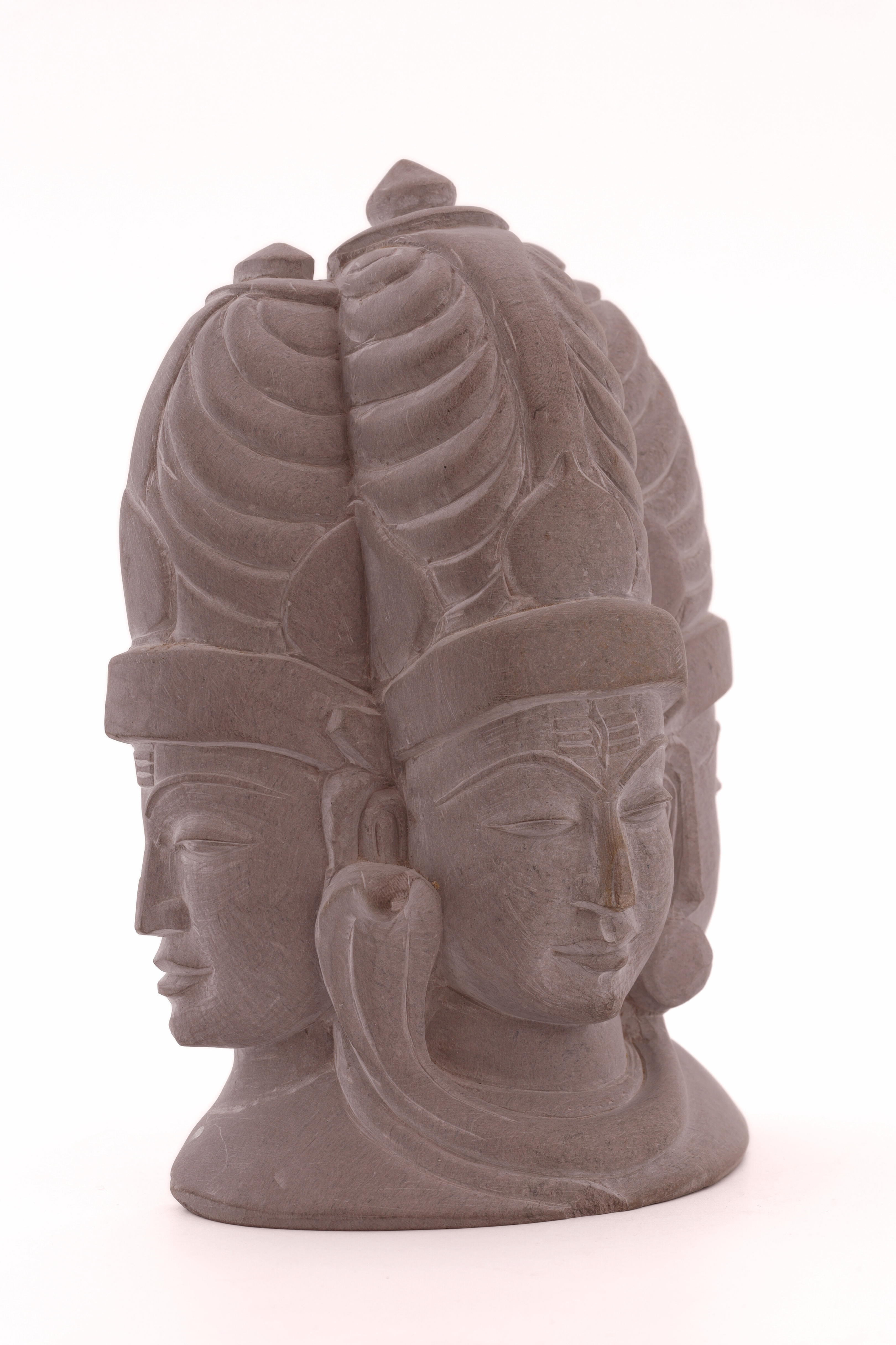Stone Shiva trinity sculpture created for meditation spaces, symbolizing inner stillness, unity, and transcendence