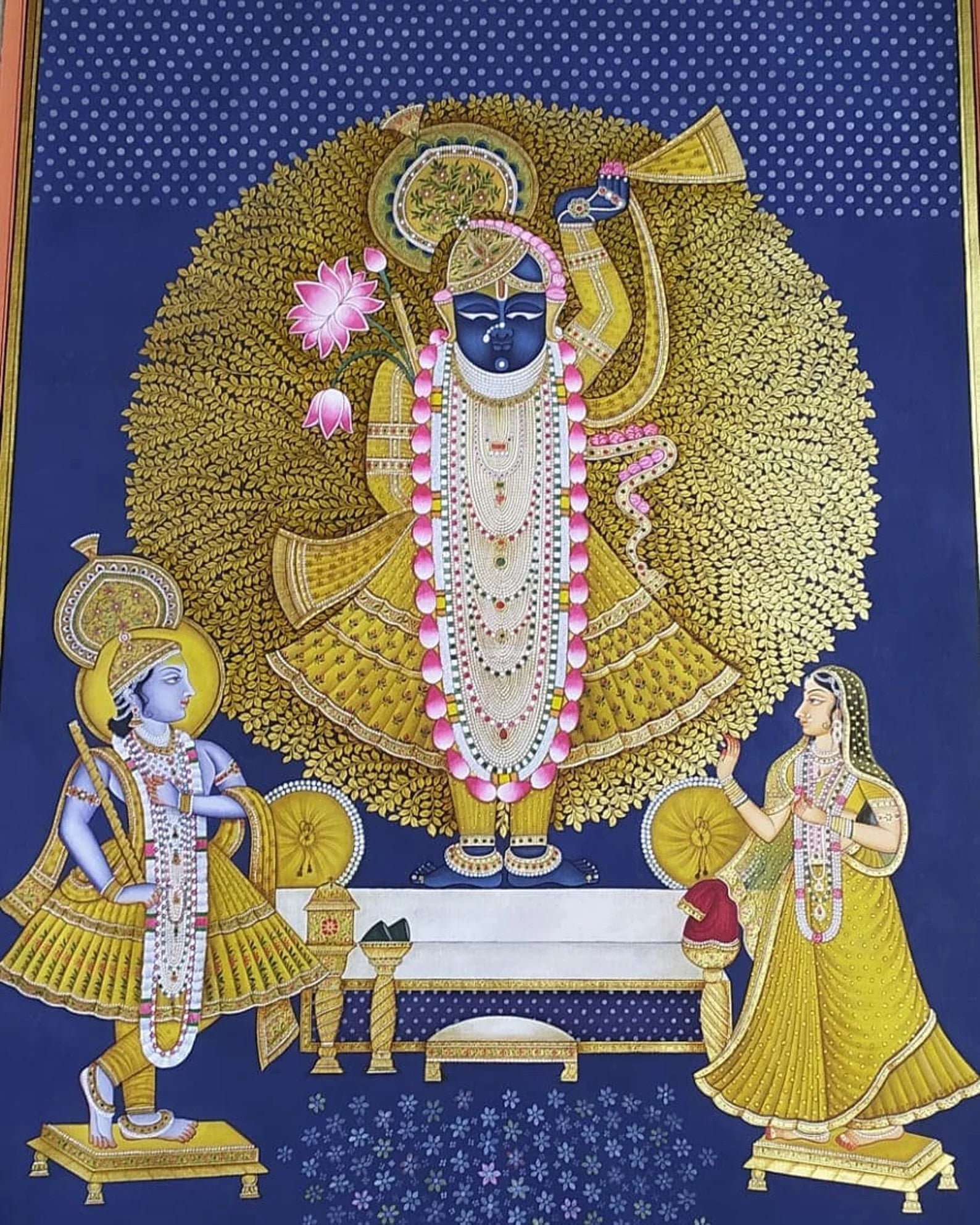 Detailed view of Shrinathji Pichwai painting highlighting gold foil work
