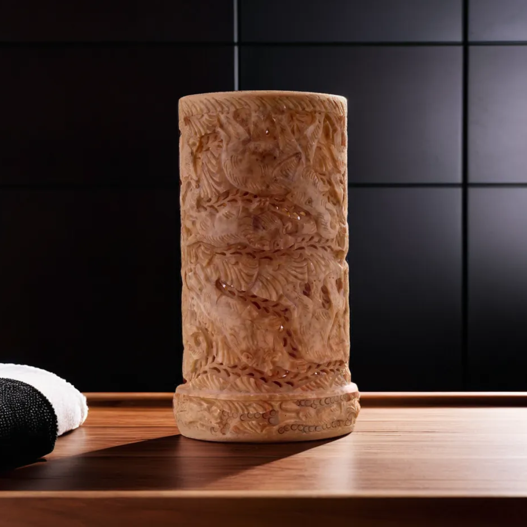 Standing soapstone lampshade handcrafted from natural stone, featuring a smooth carved finish for warm ambient home lighting