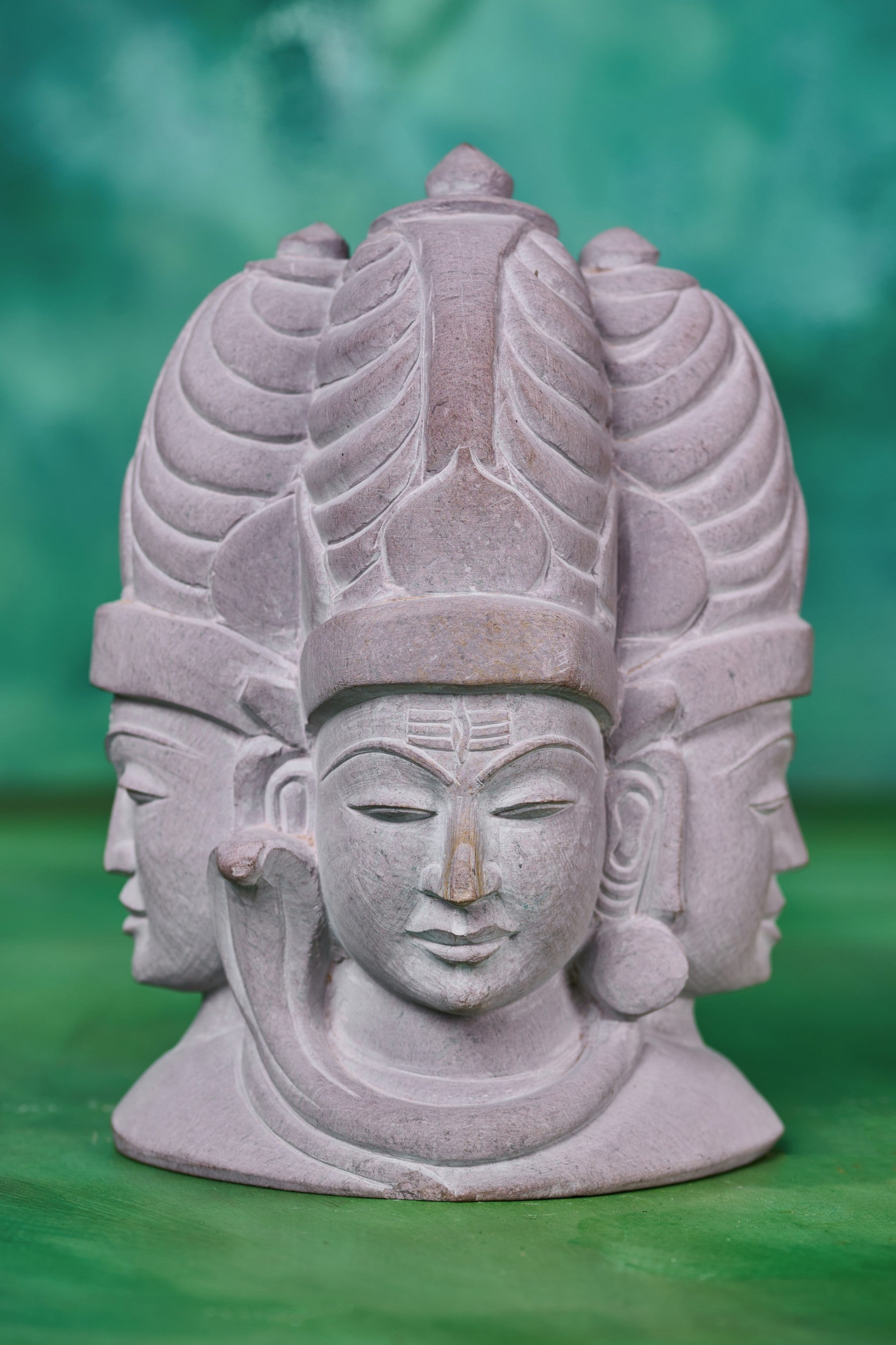 Stone Shiva trinity sculpture depicting the sacred threefold form of Lord Shiva, symbolizing creation, balance, and cosmic energy for spiritual home décor