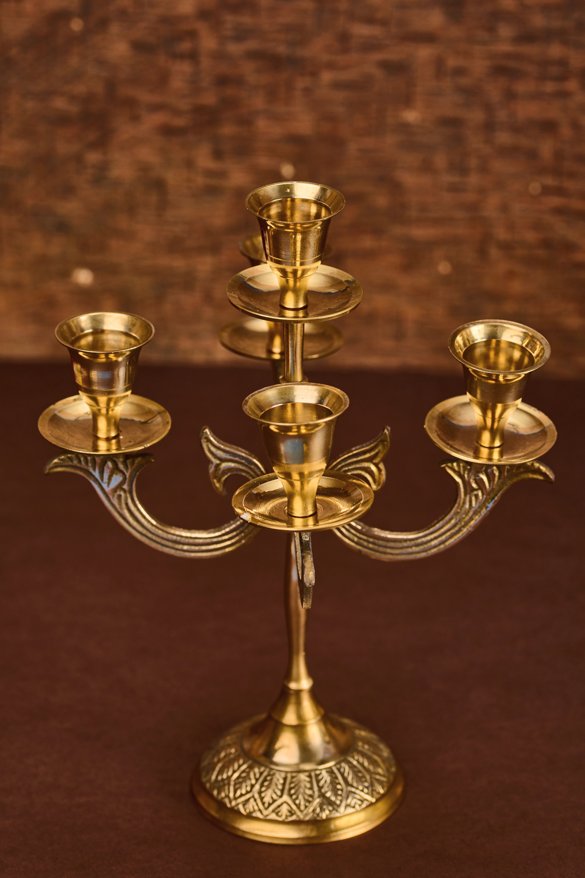 Victorian style brass candelabra featuring ornate detailing and a classic antique inspired design for elegant home décor