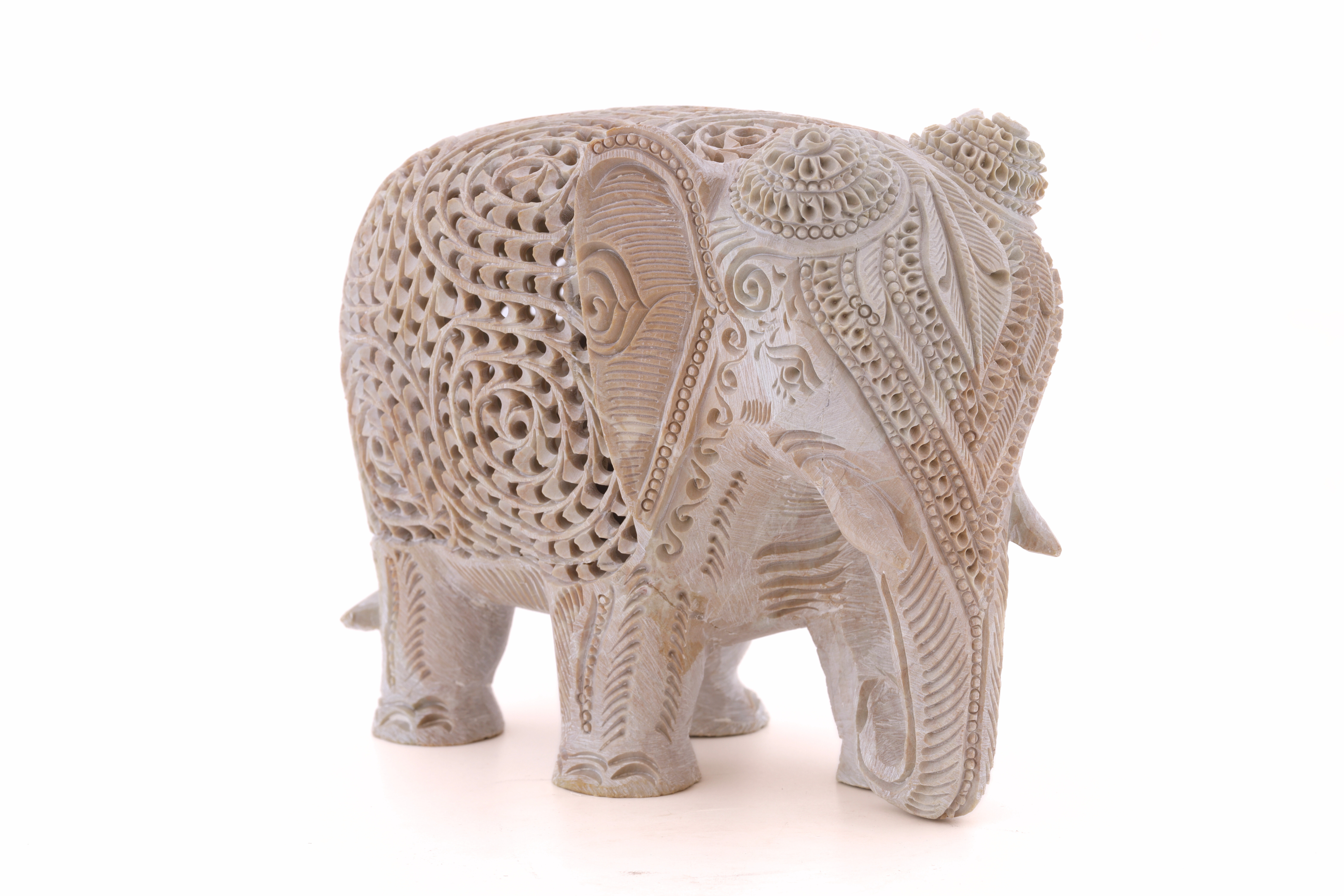 White stone elephant sculpture with detailed carving, designed as a symbolic and timeless home décor accent