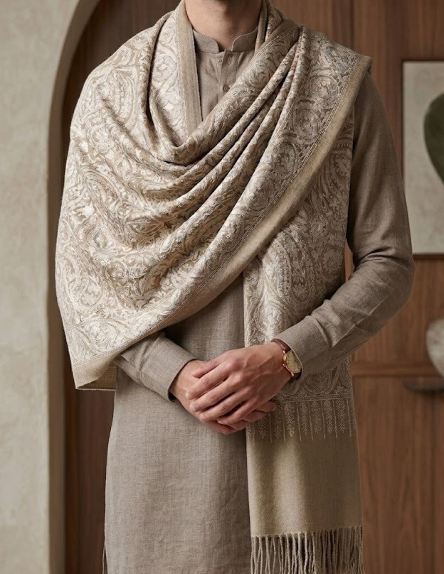 Close-up of Sozni border embroidery on ivory wool silk.
