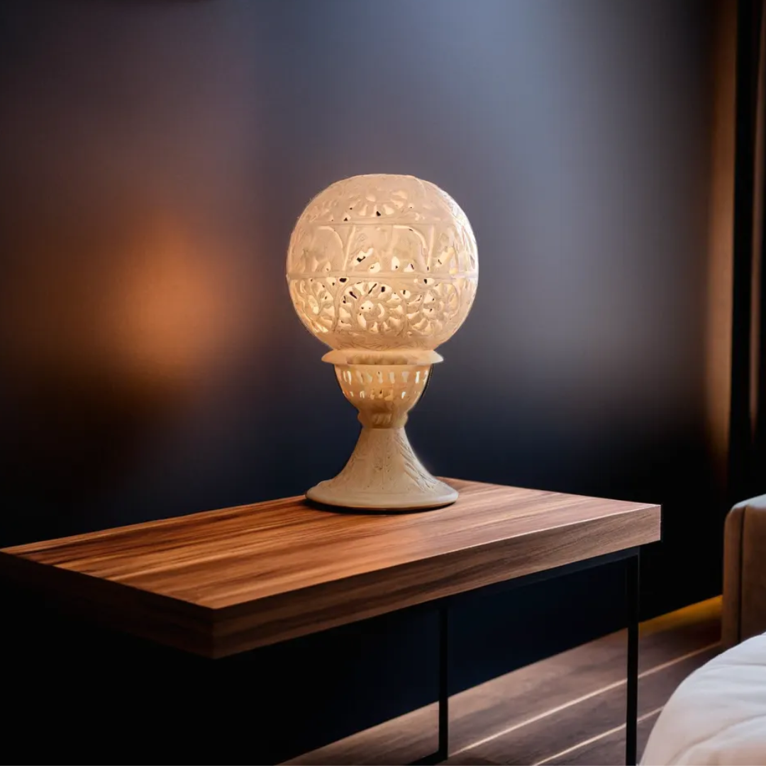 Soapstone carved lamp glowing on wooden side table – ambient meditation lighting for home decor