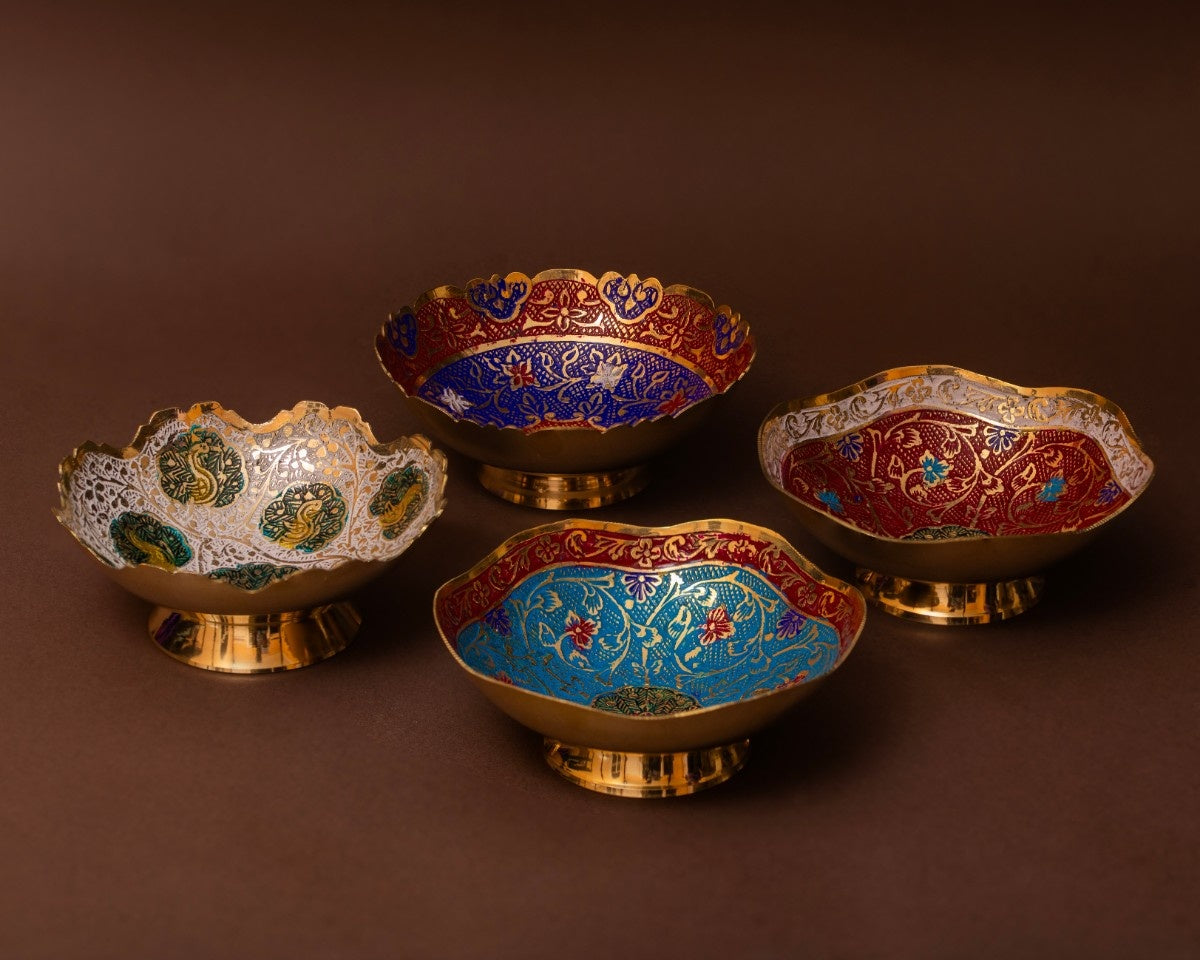 Set of four ornate bowls with intricate designs 