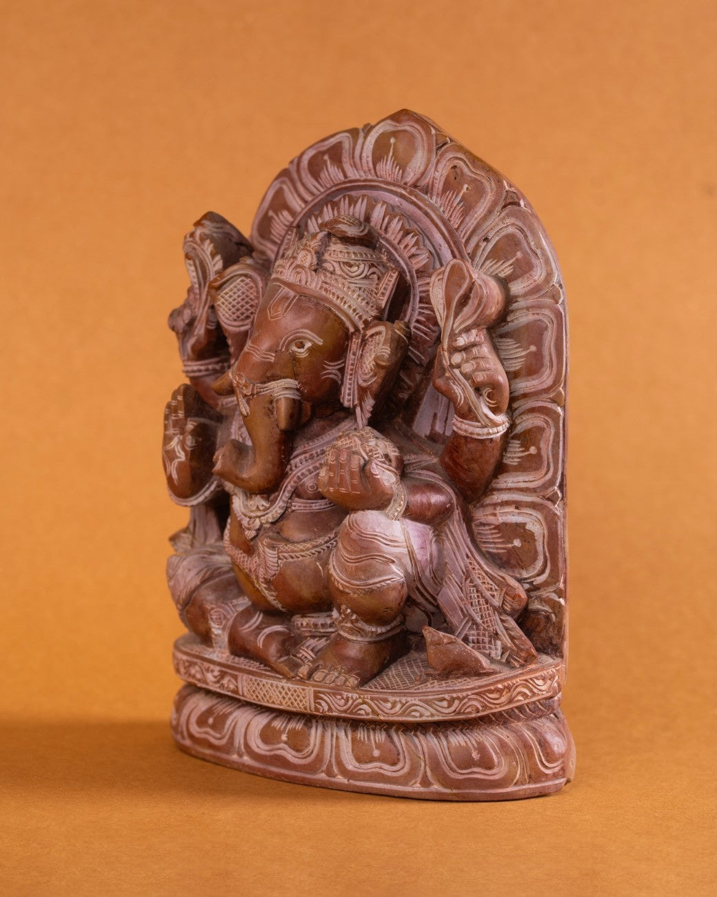 Red stone Ganesh statue front view carved from deep red marble