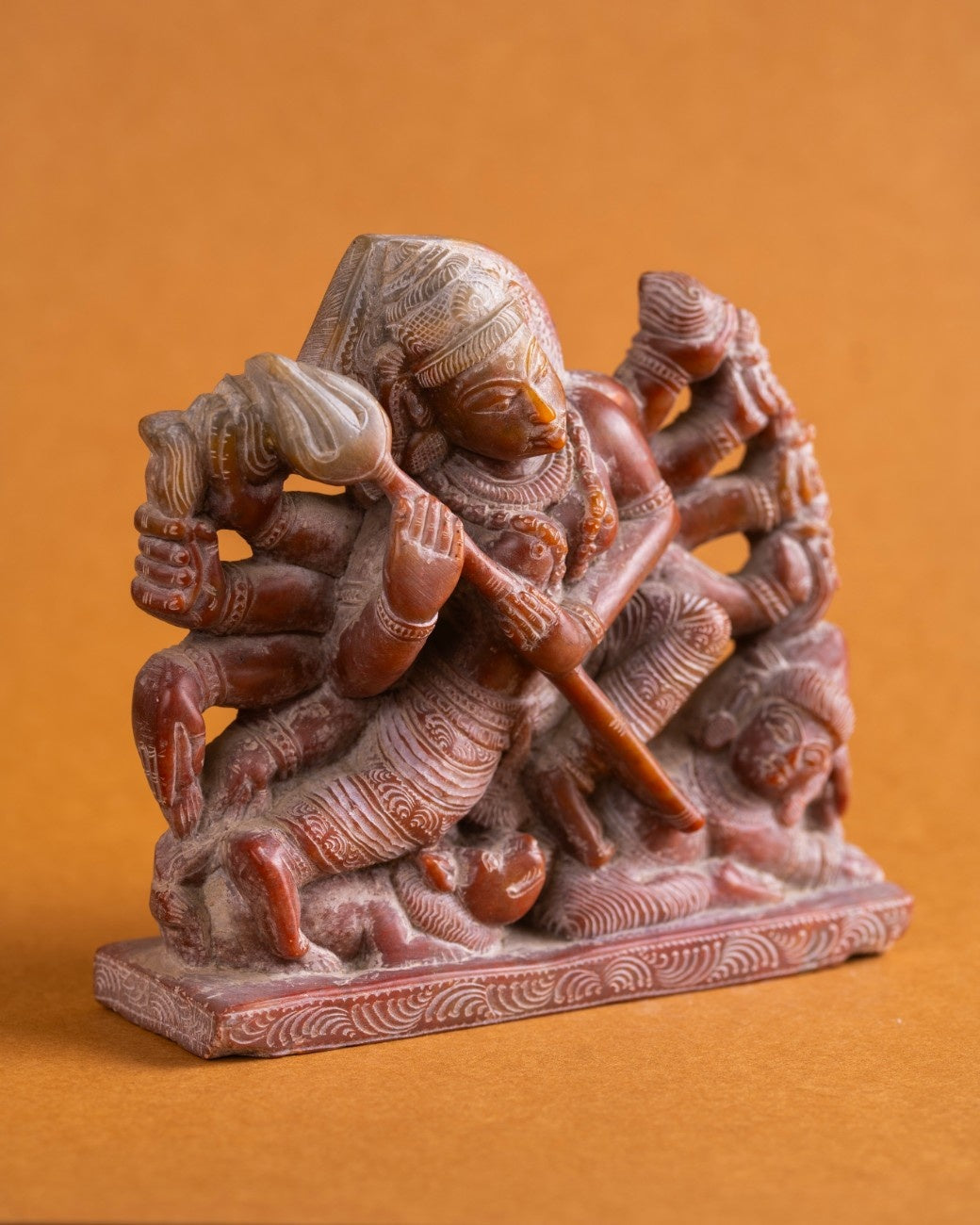 Decorative Indian red stone statue of Kali – sacred sculpture for home or altar