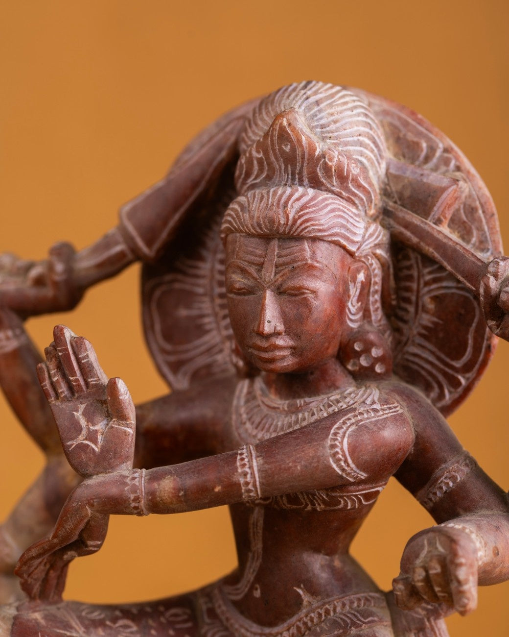 Close-up of Shiva sculpture face showing fine carving and expression.