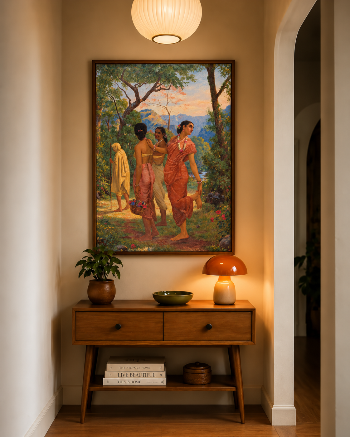 Framed print above a wooden console with a mushroom lamp and potted plant in a hallway